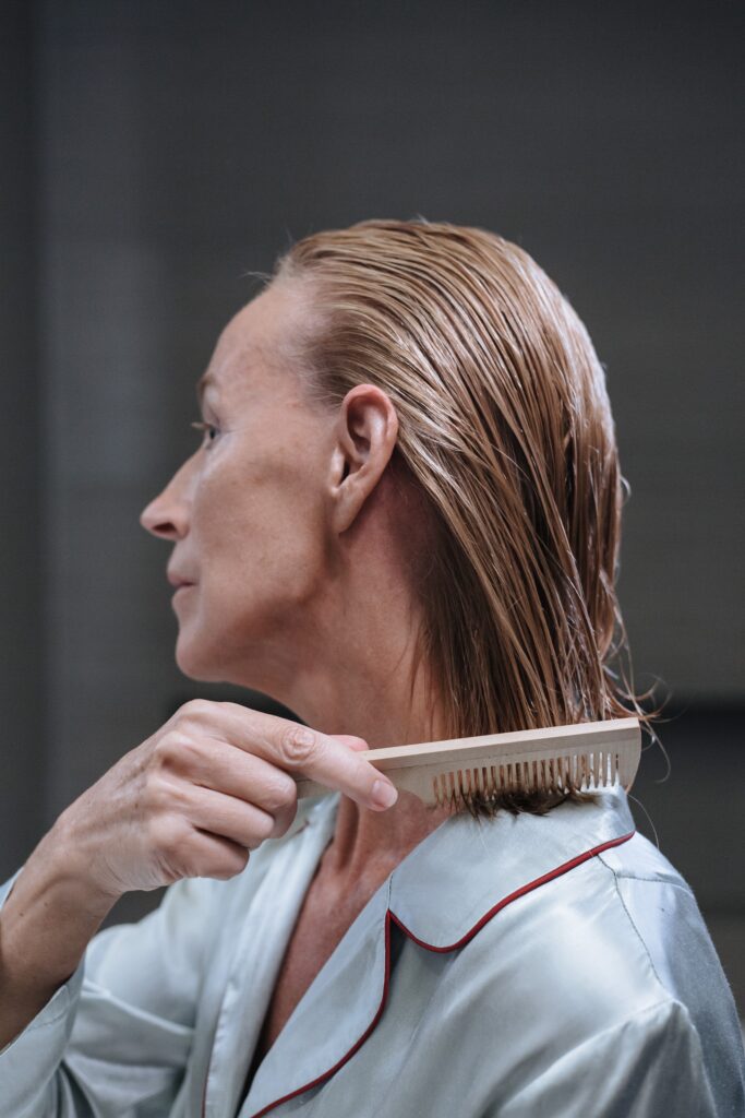 a woman brushing her hair